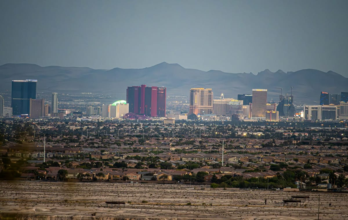 The Reno skyline against the Sierra Nevada at dusk